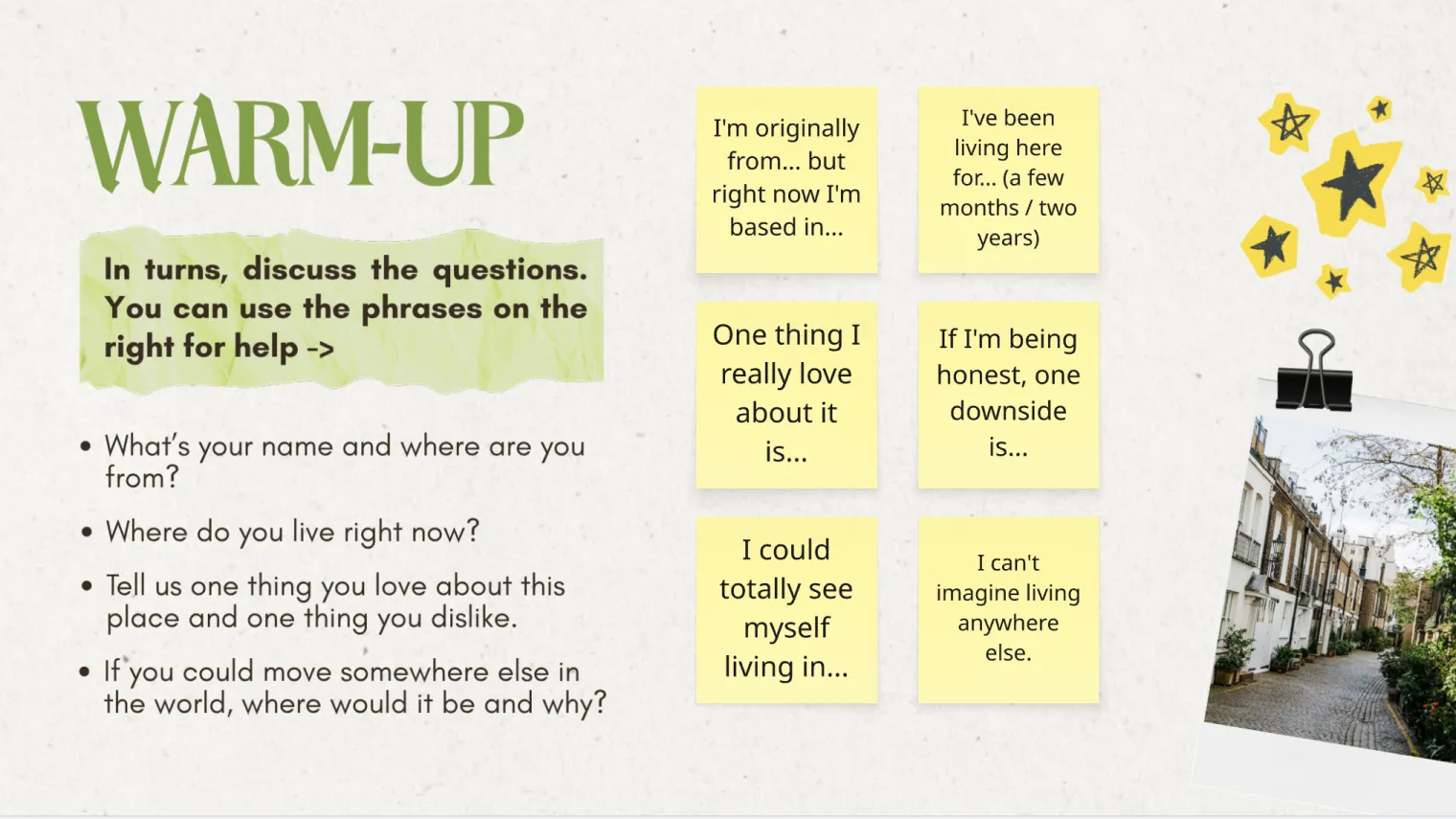 Slide headed “Warm-up” with four introduction questions on the left and six yellow sticky notes of sentence starters on the right, such as “I’m originally from… but right now I’m based in…”.